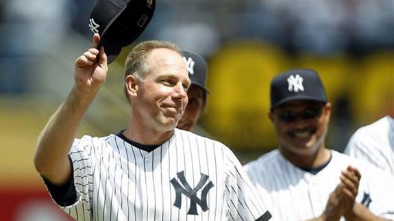 New York Yankees' third baseman Scott Brosius throws to first