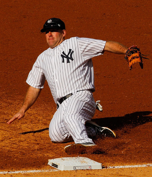 The play that re-injured Youkilis' back. (Mike Stobe/Getty)