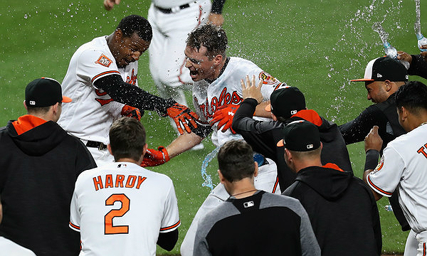 Trey Mancini after a walk-off (Rob Carr/Getty Images North America)