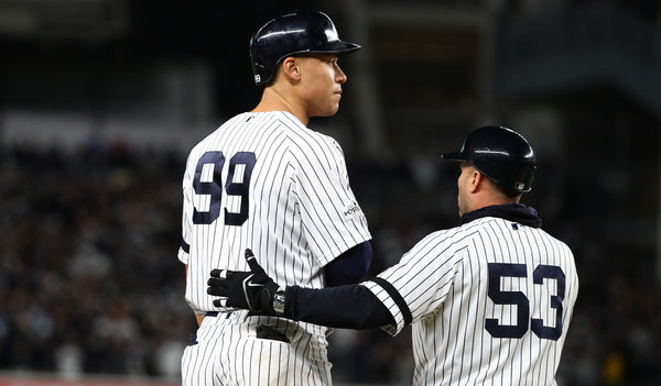 No one ever takes pictures of the third base coach. (Al Bello/Getty)