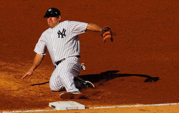 Easy on the back, Youk. (Mike Stobe/Getty)