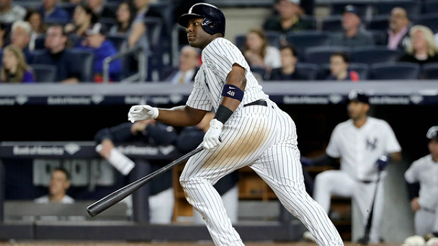 Believe it or not, Chris Carter got a hit on this one. (Elsa/Getty Images)