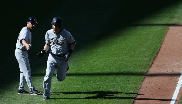 No one ever takes pictures of the third base coach. (Rob Carr/Getty)